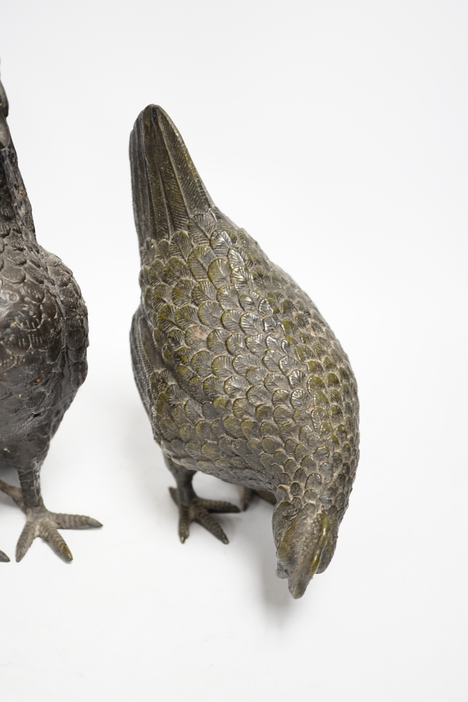 A pair of modern bronze models of a cockerel and chicken, largest 29cm high